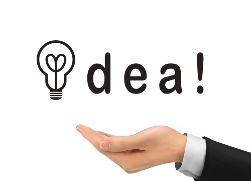 idea word holding by realistic hand over white background